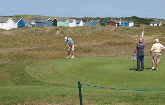 Phil Platten and Nigel Evans keeping an eye on the line from Peter Lomas' put on 18.